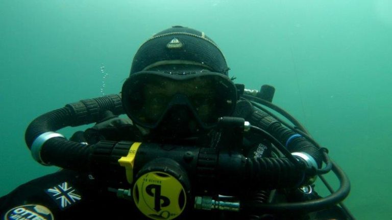 Diver doing impression of the Vectis Expeditions logo